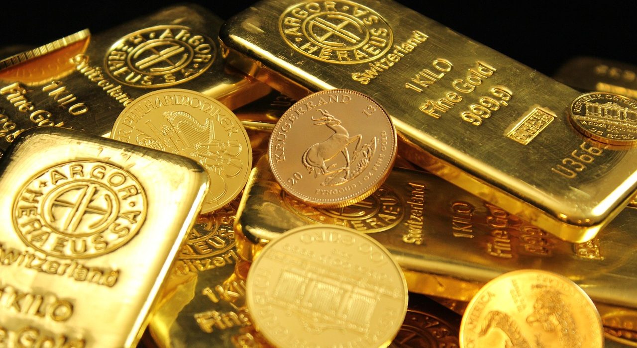 Gold bars on a financial chart illustrating a gold price correction