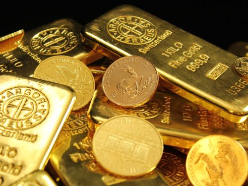 Gold bars on a financial chart illustrating a gold price correction