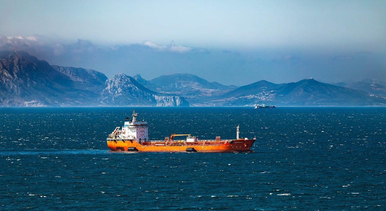 Large cargo ship representing Strait of Hormuz shipping risks